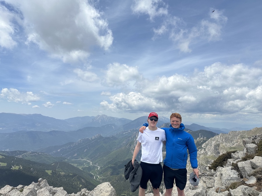 Hikers celebrating on a mountain summit